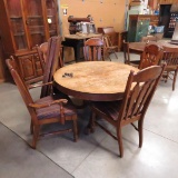 Antique wood claw foot table, 5 leaves & 5 chairs