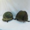 2 US Military helmets with camo covers