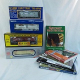 4 O gauge train cars in boxes & 5 train books