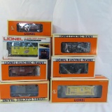 7 Lionel O gauge train cars with boxes