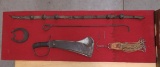 Vintage weapons & such on display board