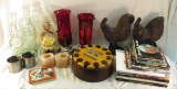 Wooden roosters, candle holders, Far Side books