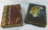 Two antique photo albums with photos