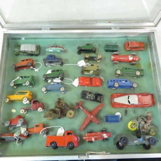 Cast iron cars, motorcycle, jeep in display case