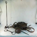 Vintage leather horse bridles and branding iron