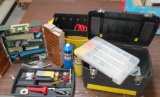Toolbox with pipe fitting tools and box of parts