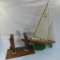 Wood model sailboat on custom cedar stand