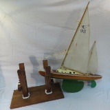Wood model sailboat on custom cedar stand