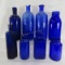 8 antique blue glass bottles including poison