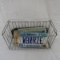 Vintage MN license plates in wire basket