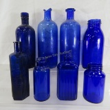 8 antique blue glass bottles including poison
