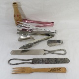 Assorted kitchen tools with advertising