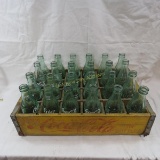 Wooden case with 24 Coca-Cola bottles