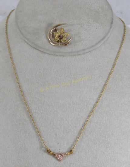 10kt gold necklace & brooch with leaf motif