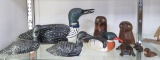 Carved wood loons and other animals