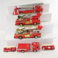 4 Plastic Fire Trucks and 2 Plastic Models