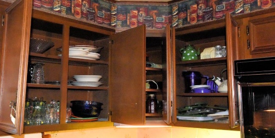 Lot #22- Contents of corner three upper cabinets to include: Coca-Cola glasses, emerald  pattern