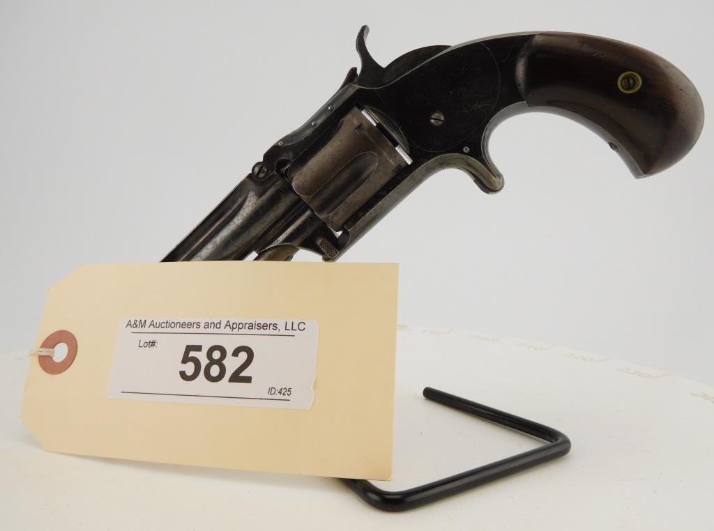 Lot #582 - S&W 1-1/2, New Issue Spur Rev.
