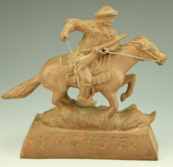 Lot 3392 - Winchester cast iron figural horse and rider advertising statuette 7 ½”