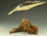 Lot 3422 - Feeding Contemporary Dowitcher on driftwood branded “Tater” on underside 11” x  14”