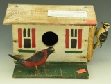Lot 3529 - Very Nice Primitive carved birdhouse with red/black bird & Downy Woodpecker (8”x7”)