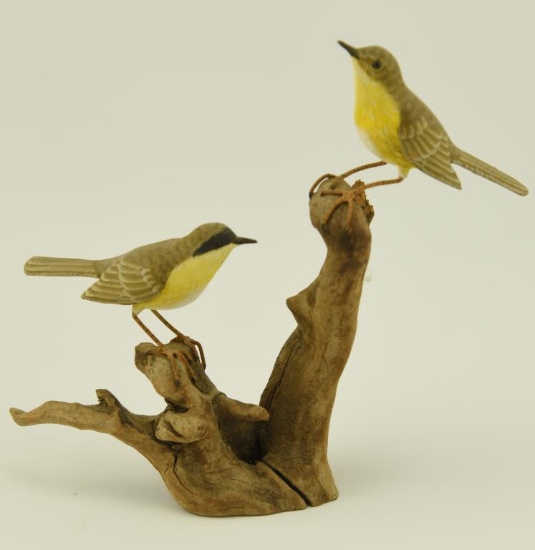 Lot 1112 - Pair of hand carved miniature Gold Finches on cypress knot carved by C. Kemper 7 ½”