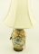 Lot 1548 - Painted porcelain lamp on oriental carved wood base (30 ½”in height)