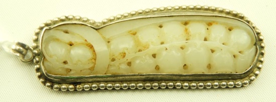 Lot 1625 - Sterling pendant with carved stone