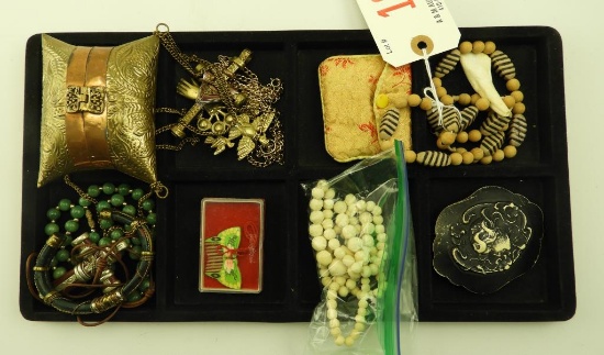 Lot 1646 - Lot of jewelry consisting of carved green stone beads, carved bone beads, an art