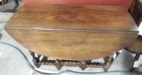 Lot 1599 - Antique oval walnut gate leg dining table (29” in height, 45” in width, and 19” in