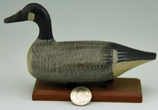 Lot #7 - Bob McGaw, Havre de Grace, MD miniature carved Canada Goose on wooden base (excellent