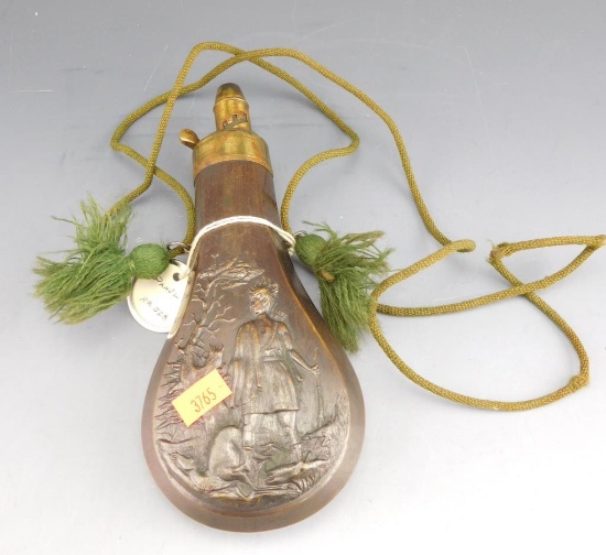 Lot #288 - Antique brass paneled powder flask with hunter and stag motif 8”