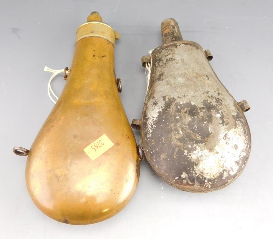 Lot #290 - (2) Antique powder flasks to include: Antique brass paneled powder flask with  hanging