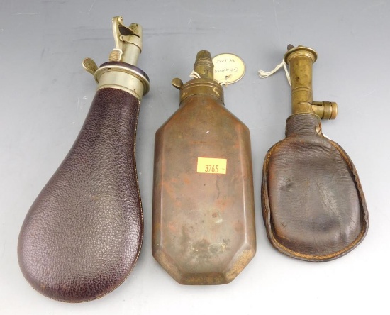 Lot #291 - (2) Leather shot pouches and (1) brass powder flask