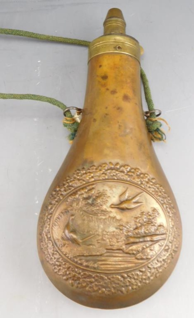 Lot #294 - Antique Brass shot flask with pheasant and flower motif 8”,