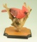 Lot #269 - Hand carved Cardinal on driftwood by R.L. Robertson signed and dated December 1985