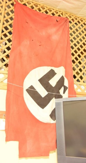 Lot #160 - Early WWII German Nazi battle flag (flag shows it usage with several tears, rips, and