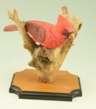 Lot #269 - Hand carved Cardinal on driftwood by R.L. Robertson signed and dated December 1985