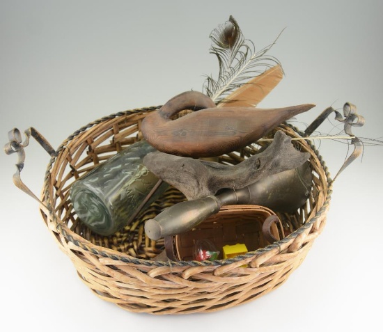 Lot #19 - Contents of bookcase to include: basket, wooden carved shorebird (damaged tail), brass