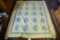 Lot #545 - Hand sewn blue and white leaf pattern quilt with blue border (72” x 82”)