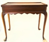 Lot #475 - Mahogany bench made rectangular tea top with raised edge, shaped skirt and Queen Anne