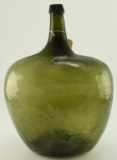 Lot #481 - Early 19th Century blown glass emerald font 20 quart demijohn with applied rim and