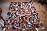 Lot #526 - Antique hand sewn crazy quilt initialed A.G. in center (some slight damage to silk