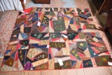 Lot #529 - Beautiful family floral silk crazy quilt with sewn initials and dated September 1894