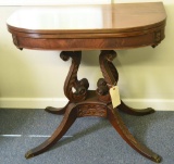 Lot #570 - Depression era Mahogany flip top Duncan Phyfe style card/game table on highly carved
