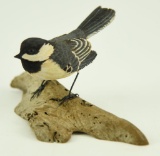 Lot #372 - Carved Black Capped Chickadee on driftwood signed and dated Pete Micciche 1983 (from