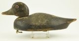Lot #512 - Primitive Bluebill decoy (loss of paint) from the Mort Kramer Collection