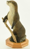 Lot #539 - Hand carved Otter on habitat base by Edward Itter Sr. signed and dated 5/2003 12” high