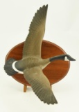Lot #656 - Charlie Joiner 1/3 size full body flying Canada Goose on plaque wall hanging signed