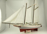 Lot #718 -Beautiful Herman Stine Jr. sailing Chesapeake Bay skipjack model with stand 48